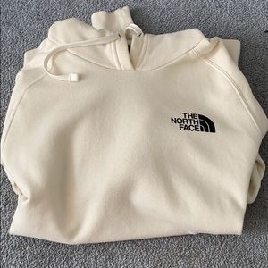 The north face cream colored sweatshirt